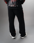 Parte de atrás del conjunto Liberty negro, buzo y pantalón